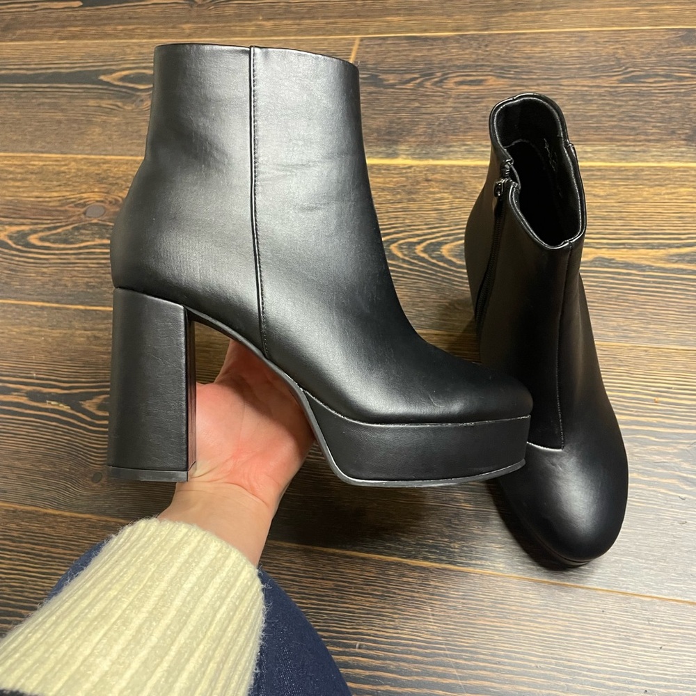 Black heeled platform boots